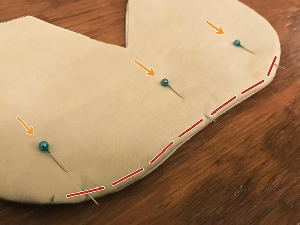 Place the prepared nose bridge insert inside the mask, between the two layers of interface material.