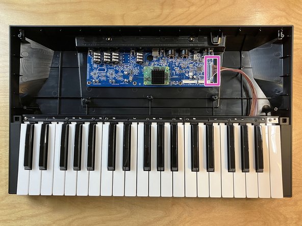 Locate the connector labeled CN8 (which has 16 pins) along the right edge of the main board. This is the keyboard connector.