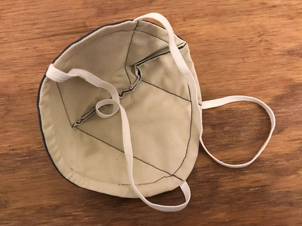 Open the mask and turn it inside-out. The stiffness of the interface material might make this process a bit crinkly.