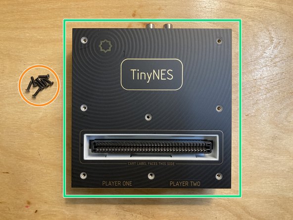 Remove the 8 marked M2.5 x 10 mm flat head machine screws from the top panel. Put the screws aside, being careful not to lose them.
