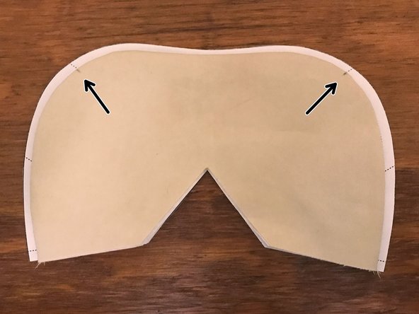 Place the mask on top of the pattern. Line up the bottom straight edges.