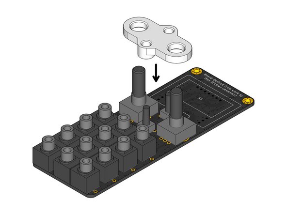 Locate the white plastic Assembly Spacer part.