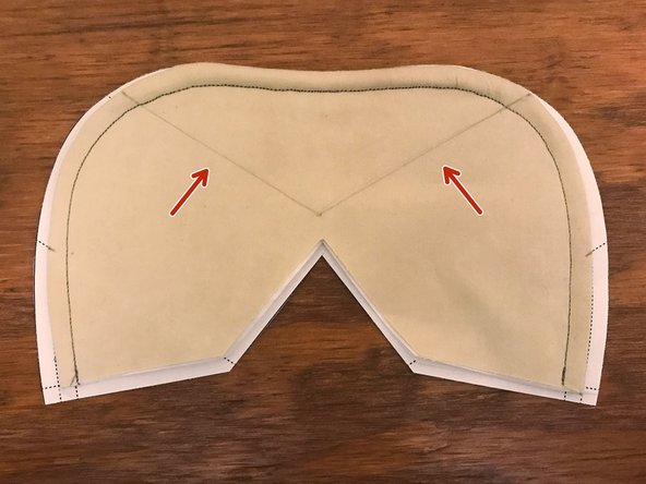 Place the mask on top of the pattern again, aligning the bottom edges.