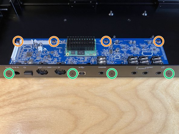 The four M3 × 6 mm pan head machine screws (from the parts bag) into the main board's four mounting holes, as pictured.