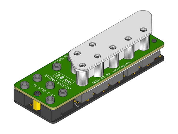 Make sure that the flat side of the Assembly Cap is facing up when orienting it relative to the top surface of the Control Board as shown.