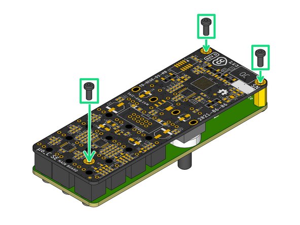 Grip the pair of boards and flip them over while applying slight pressure, holding them together so that none of the components become unseated.