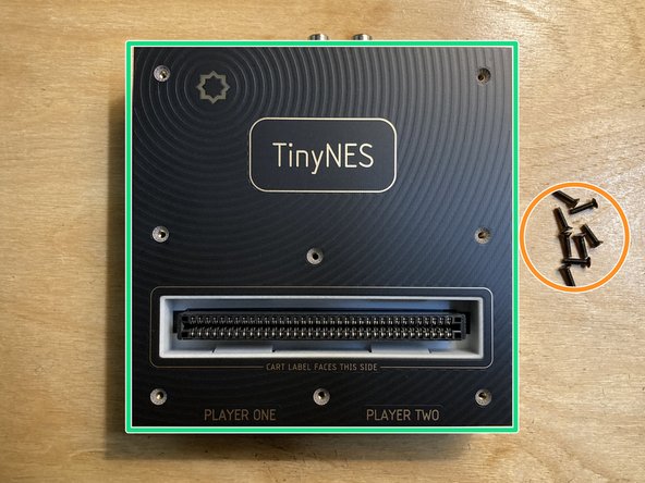 Remove the 8 marked M2.5 x 10 mm flat head machine screws from the top panel. Put the screws aside and be careful not to lose them.