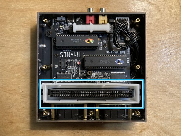 Lift the top panel off the enclosure and put it aside.