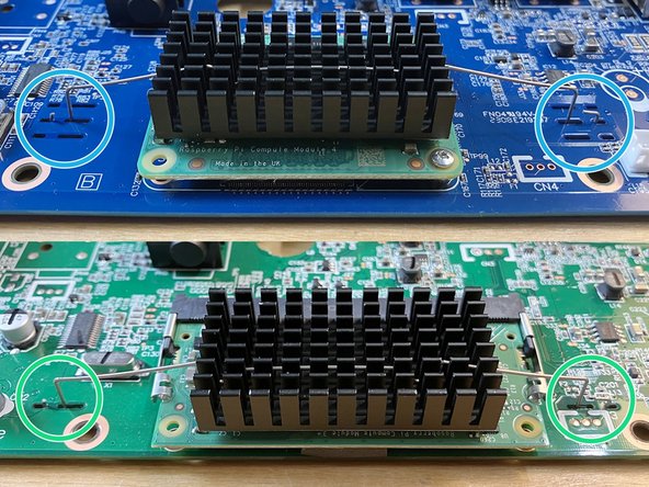 Insert the end of the clip that has the extra bend downward through one of the longer slots. Then slide it over to hook it around the little bridge between the two slots.