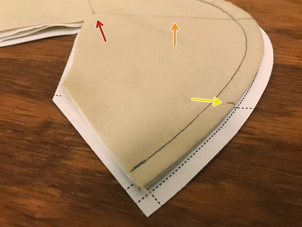 Mark a point on the mask that's about 1/4" (6 mm) above the center of the acute angle cutout point.