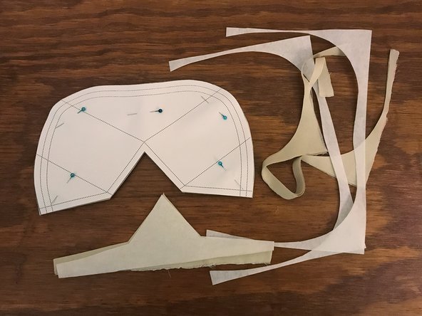 Carefully cut around the outside edge of the pattern, through all four layers of material.