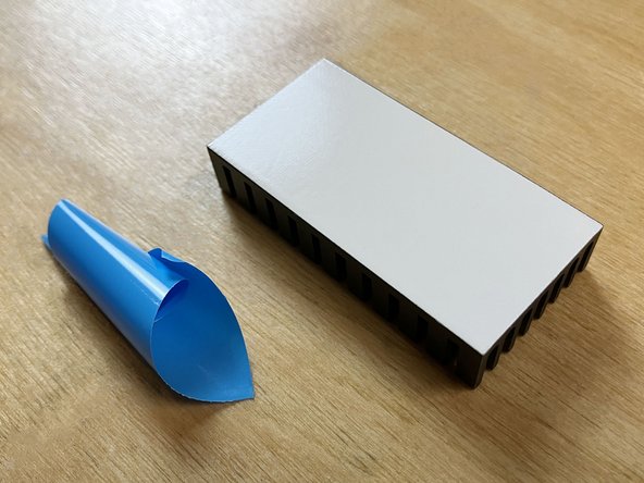 The heatsink in your kit may alternately have white protective backing instead of blue.