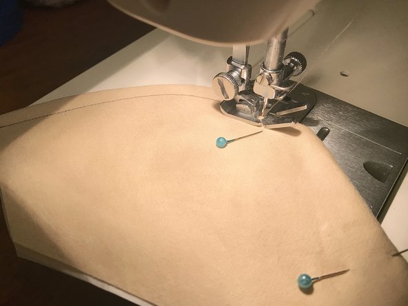 Be careful when you get to the nose bridge insert. Make sure that it stays pushed up against the seam. The presser foot will sit at an angle while you sew along the insert.