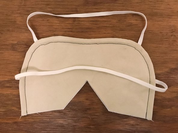 Be careful when you get to the nose bridge insert. Make sure that it stays pushed up against the seam. The presser foot will sit at an angle while you sew along the insert.