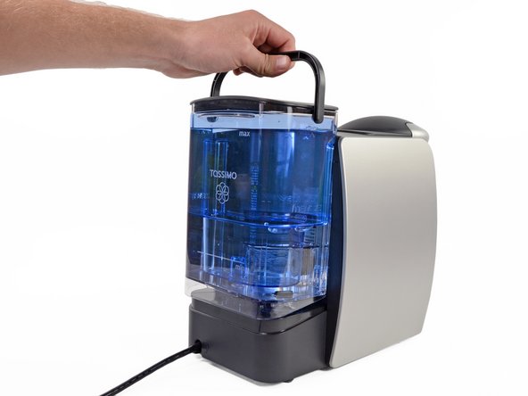 Now put the water tank back and push it firmly down into place.