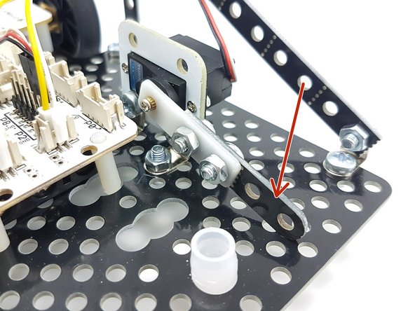 The servo works best for activating the flipper if it isn't attached directly - connect a small arm to the white plastic part like in the picture, and round of the end with a file.