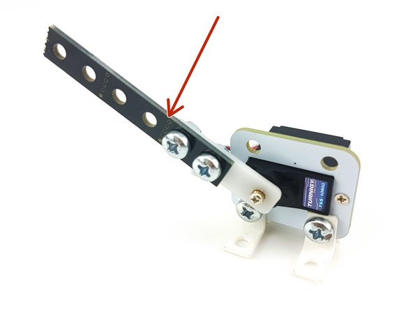 All done! Now you can use the bolts and construction kit parts to attach anything you like to the servo, such as a piece of construction kit beam.