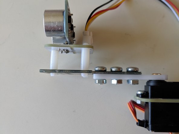 Ensure that when you push the beam left and right, it stops at the same angle from the servo. We need 0 degrees to be fully left and 180 degrees to be fully right or else it won't work! Readjust your beam if not.