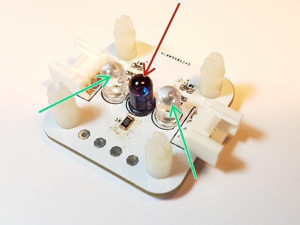 Turn the robot over and look at the bottom of the line sensor. You should see 3 LEDs.