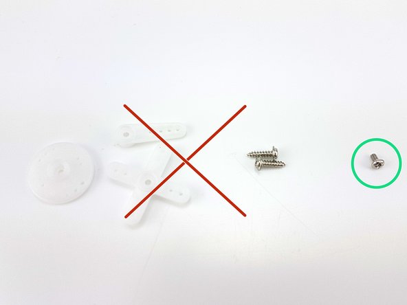 Unpack the really small bag with white plastic and screws in, and find the smallest screw - we don't need the other parts.