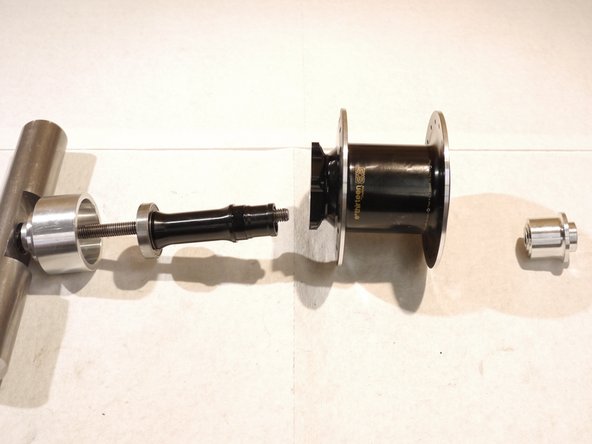 Remove the axle and bearing from the hub shell