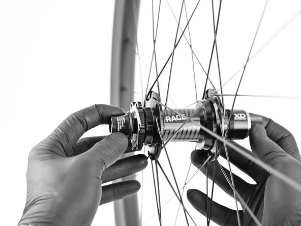 Install non-drive axle endcap. Apply pressure and tighten clockwise until endcap spins freely.