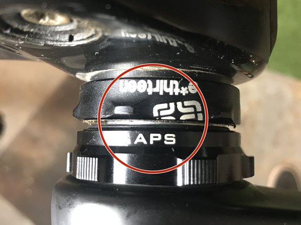 There should be a 1-2mm gap between the APS adjuster and bottom bracket.