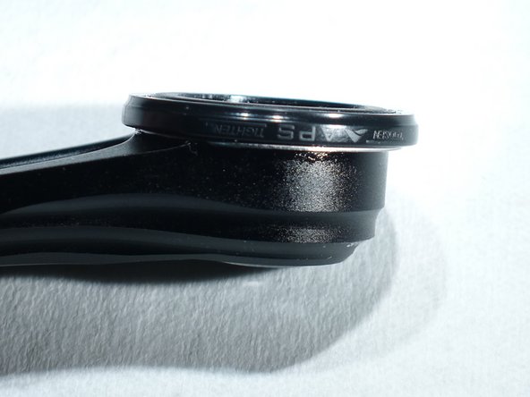 notches on the outer ring should press up against the spring