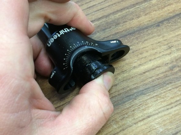 The spring is not directional, so either side can go up or down