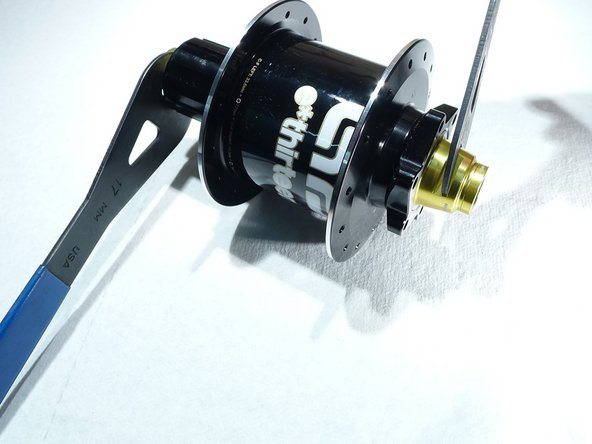 Use cone wrenches as needed, but often this can be done by hand