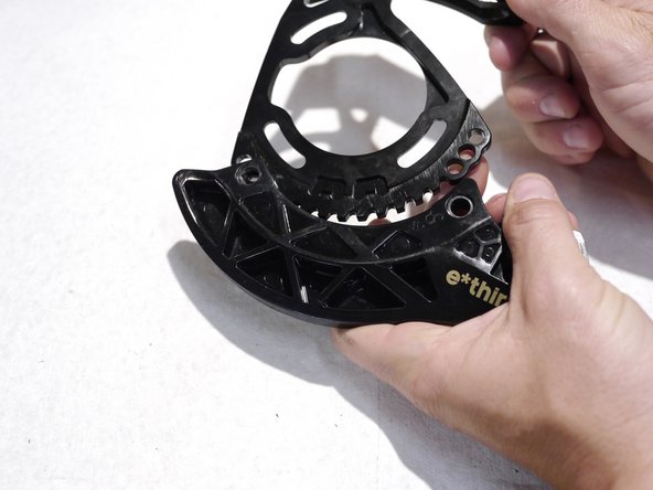 The direct mount bashguard is keyed into the back plate, to remove the direct mount bashgaurd pull firmly on the back of the bashguard