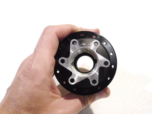 Look inside the hub shell, you will see two cut outs in the bearing stop for the drive side bearing