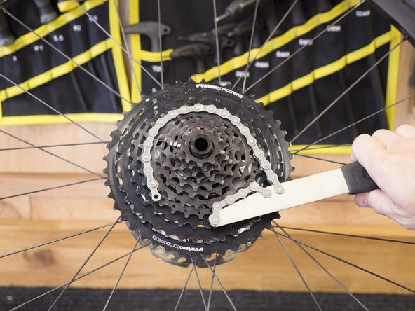 Using a chainwhip, turn the steel sprocket assembly clockwise to lock it in place.