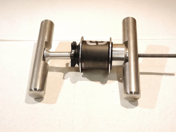 Place the removal cup on the drive side and install the handles