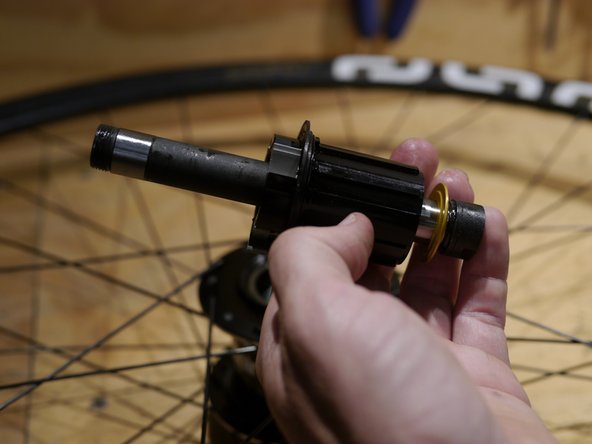 Slide the freehub shim onto the axle after the freehub body