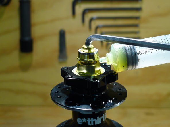 Lightly grease the face where the endcap and preload ring will meet