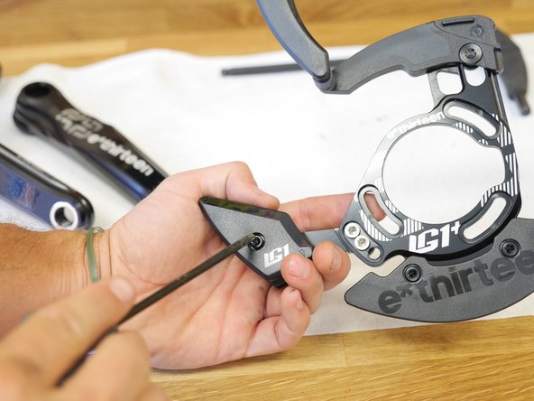 Loosen the lower slider bolt using a T25 Torx wrench