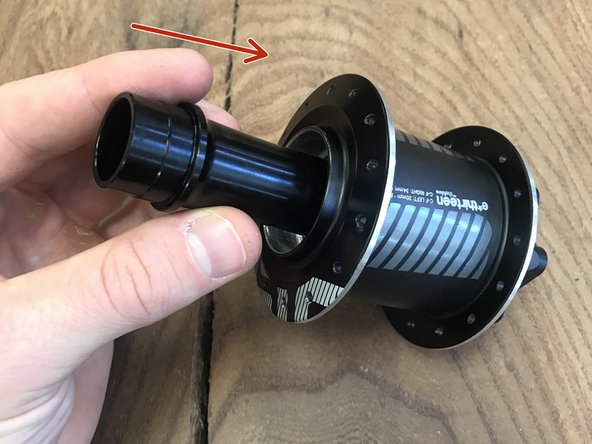 Insert the axle sleeve back into the hub to press out bearing on disc side