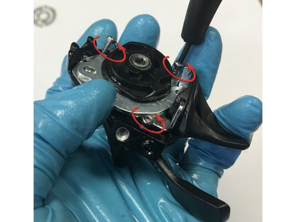 With the main pivot bolt securing the shifter, you can now remove the three 2.5mm hex screws holding the shifter together against the claw.