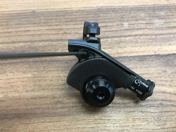 Loosen the 2mm cover screw and  remove the cover screw and cover