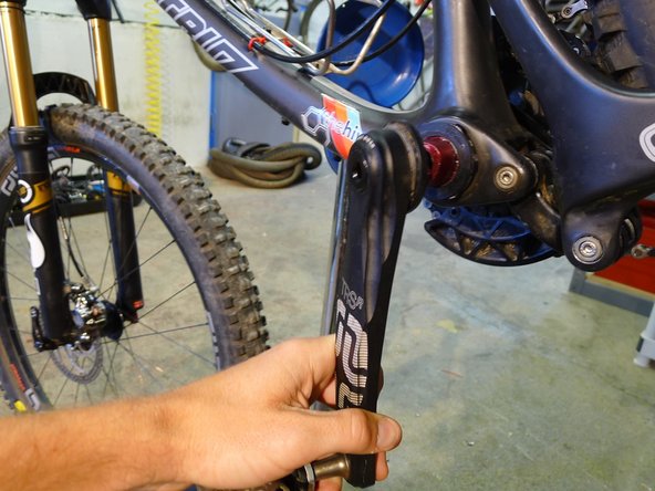 Once the tool is fully threaded in, pull sharply on the pedal end of the crankarm, this will release the crank arm