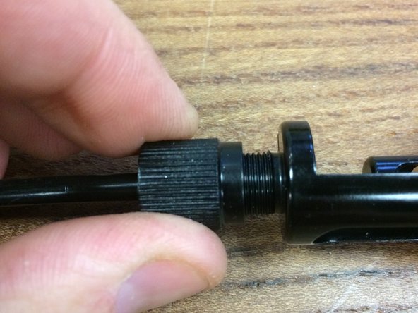 With the clamp nut tight, slide the post into the frame