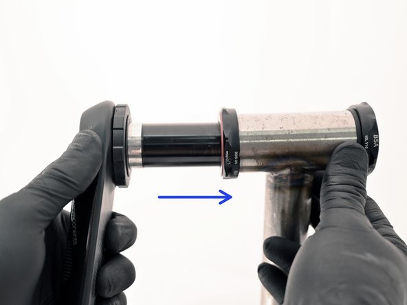 Slide the non-driveside arm and spindle assembly through the BB and ensure it is fully seated. Do not use a hammer as this may damage the bearings