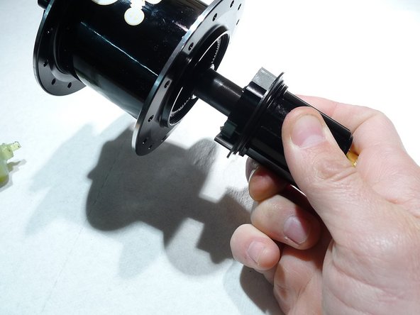 Lightly grease the hub's ratchet ring and seal face using Mobil XHP-222 grease