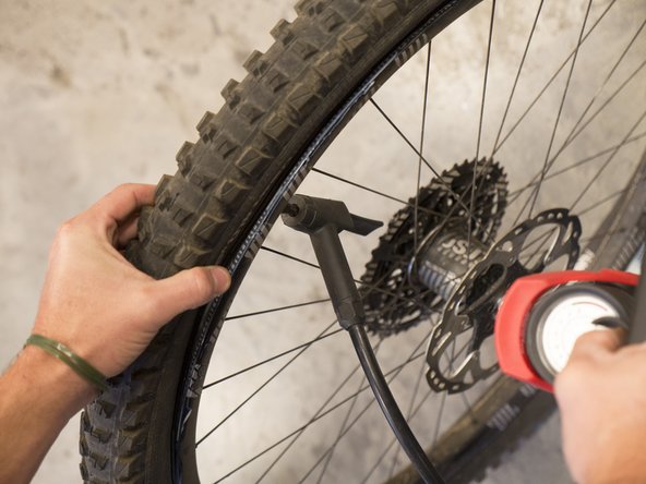 Begin inflating the tire. During the inflation process, inspect bead to ensure it is staying within the rim well. Inflate slowly until the entire bead has seated in place.