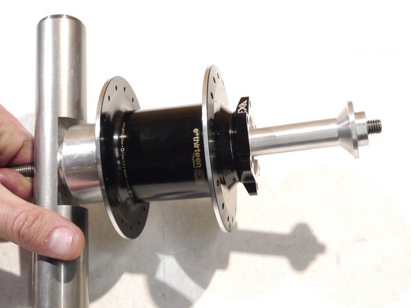 Slide the press rod over the threaded rod and onto the removal tool