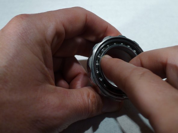 Be sure to pack grease into the bearing, then turn the bearing to help the grease penetrate into the race and balls