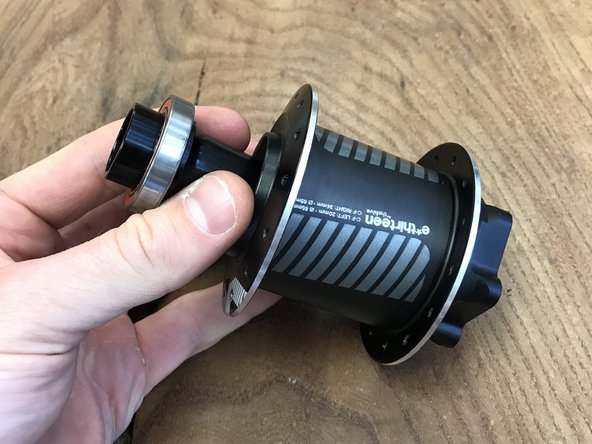 Insert the axle sleeve into the non-disc side of the hub shell