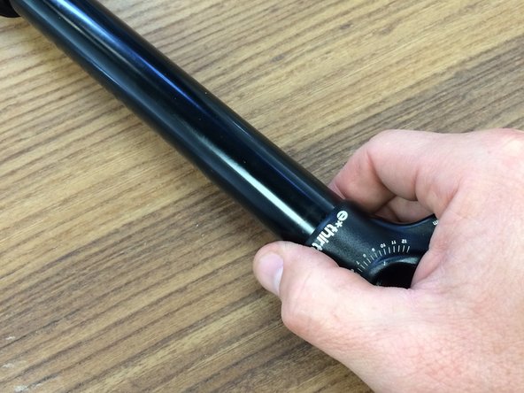 The spring is not directional, so either side can go up or down