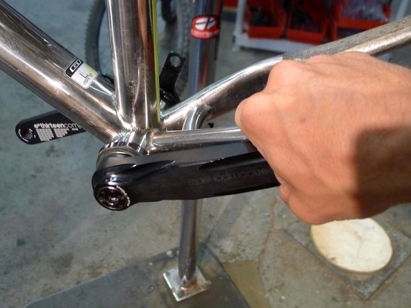 You can check for side to side play in the spindle by squeezing the non-drive arm against the chainstay, if you get movement, and another spindle spacer.